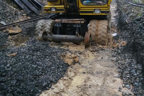 a truck traveling down a dirt road
