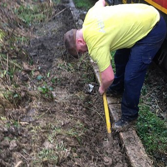 a man that is standing in the grass