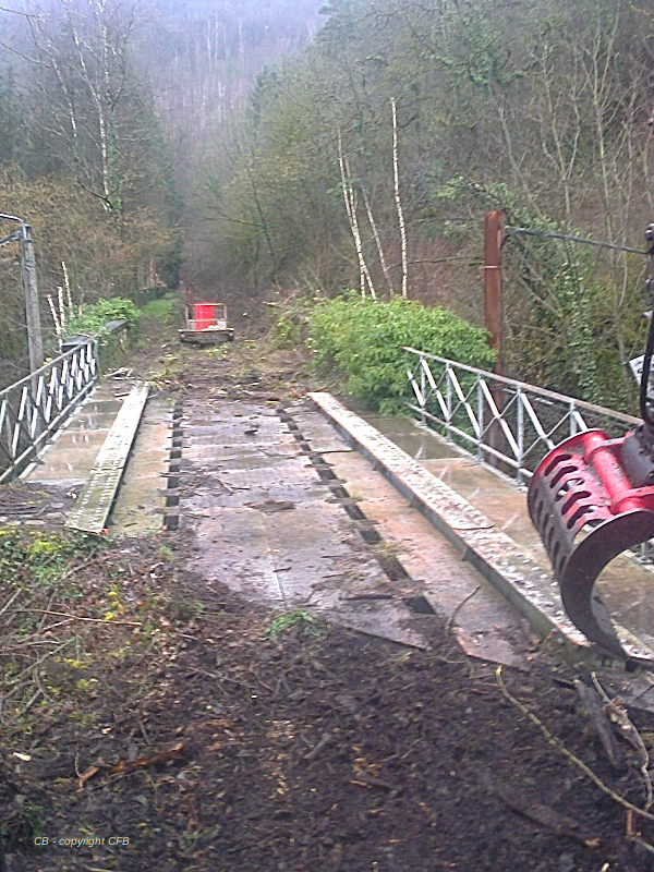 a person riding a bike down a dirt road