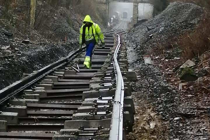 a person walking across a bridge