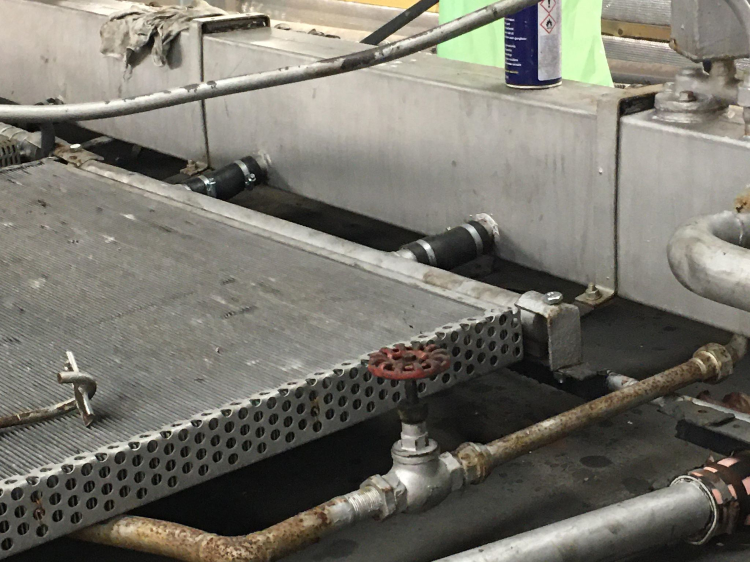 a group of people standing around a plane