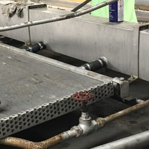 a group of people standing around a plane