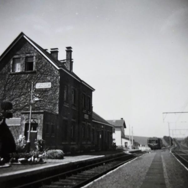 a train is parked on the side of a building