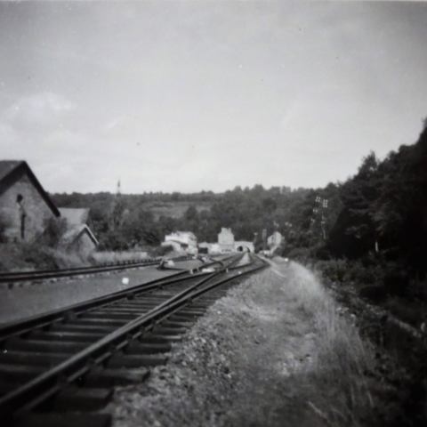 a vintage photo of a train on a steel track