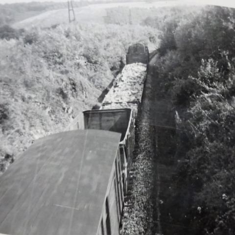 a man riding on top of a wooden ramp