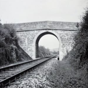 a steam engine train traveling down train tracks