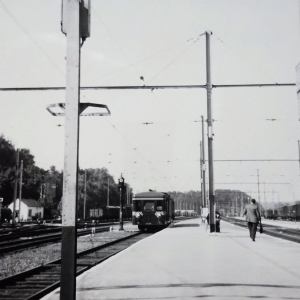 a train is parked on the side of the street