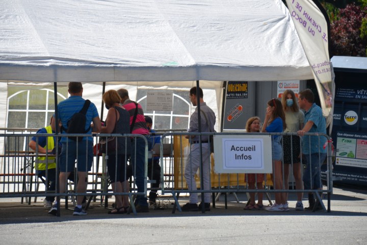 a group of people standing in front of a building