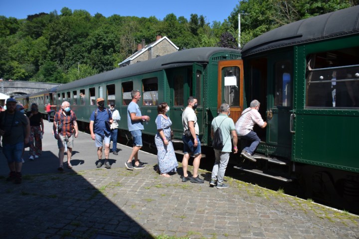 a group of people standing in a train station