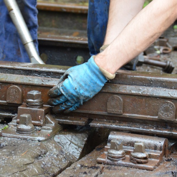 a man sitting on a wooden bench