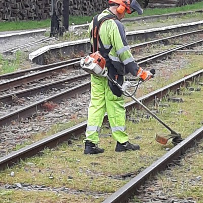 a man sitting on a train track
