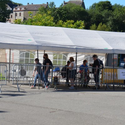 a group of people standing in a parking lot