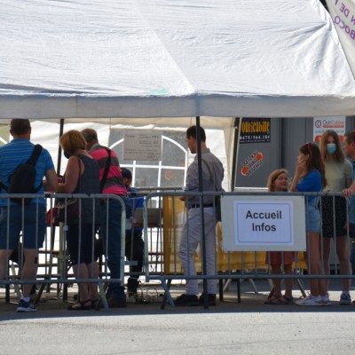 a group of people standing in front of a building