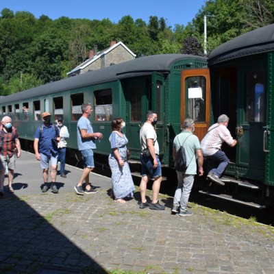 a group of people standing in a train station