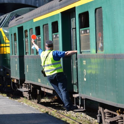a person standing next to a train