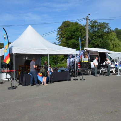a group of people standing in a parking lot