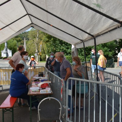 a group of people riding on top of a wooden fence