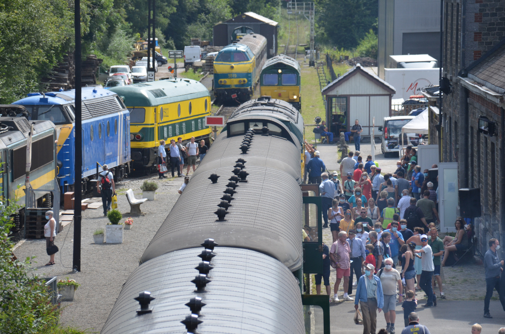 a group of people walking on a sidewalk