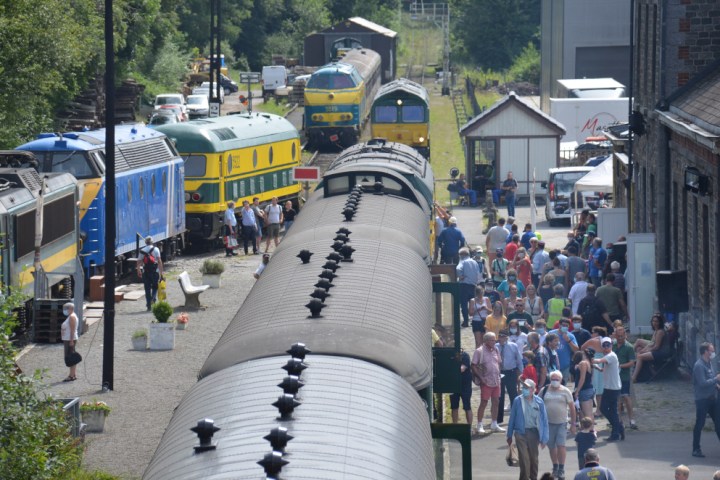 a group of people walking on a sidewalk