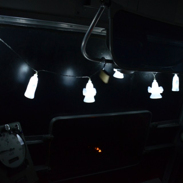 a stove top oven sitting in a dark room