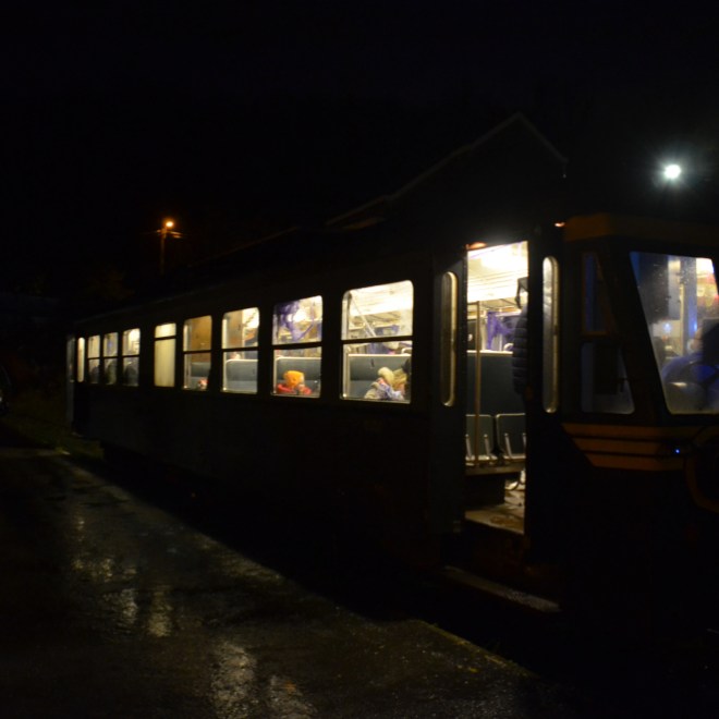 a bus is lit up at night