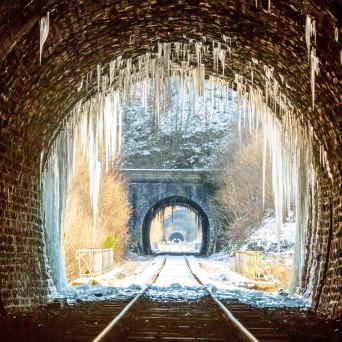 a clock sitting in front of a window