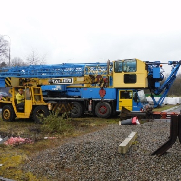 a truck driving down a dirt road