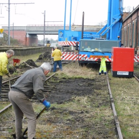 a person standing next to a train
