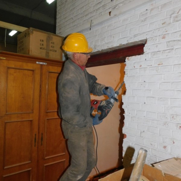 a person that is standing in the kitchen