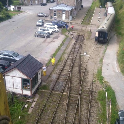 a train is parked on the side of a road