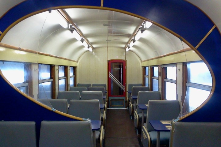 a room filled with furniture and a large window