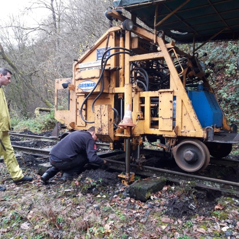 a man standing next to a truck