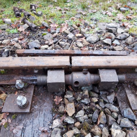 a pizza sitting on top of a rock