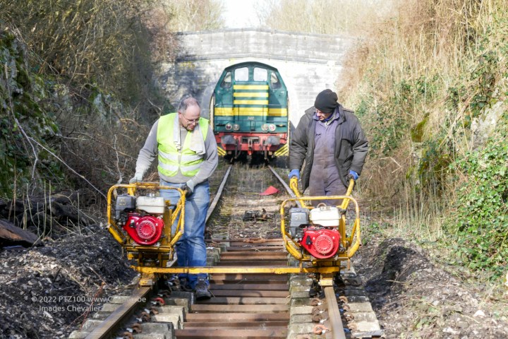 a person riding a bike down a dirt road