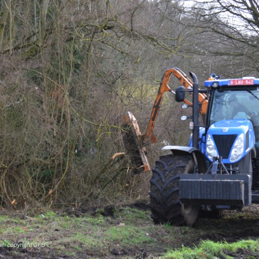 a tractor parked in the grass