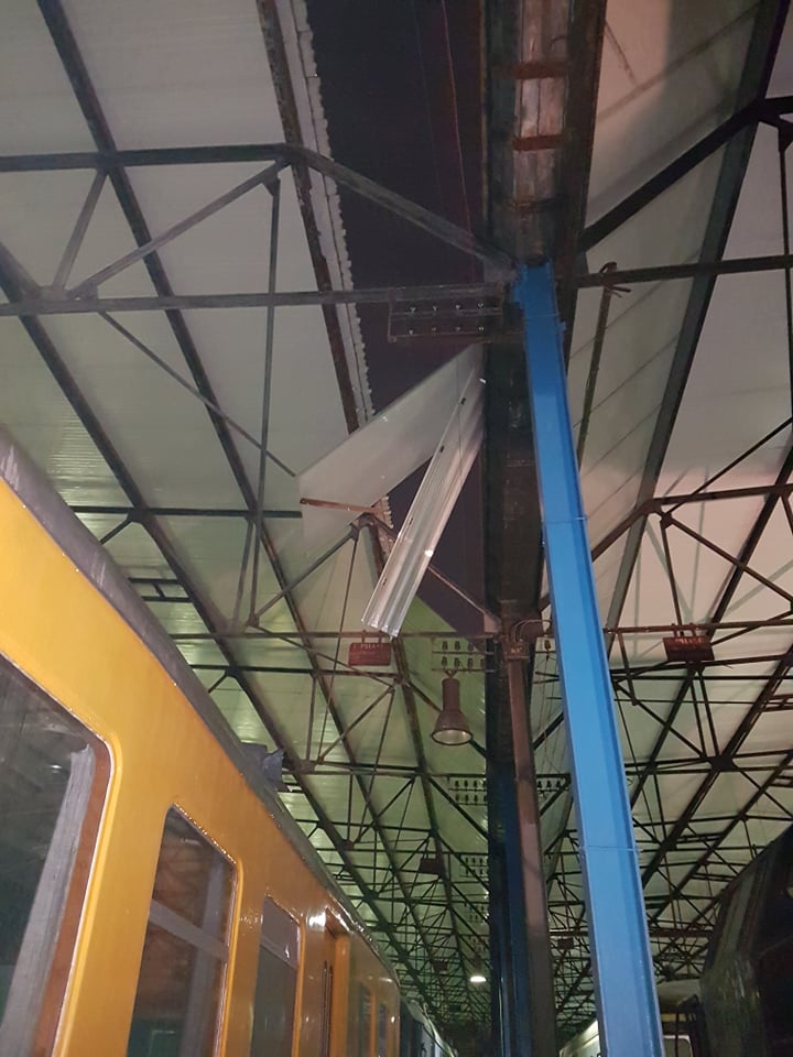 a group of people sitting at a train station