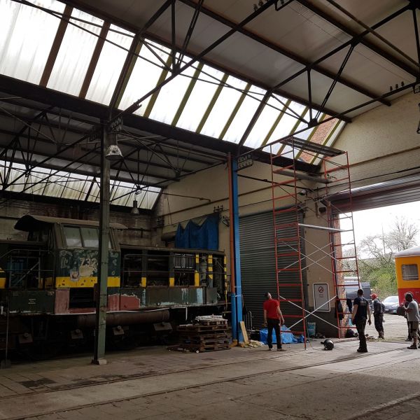 a group of people sitting at a train station