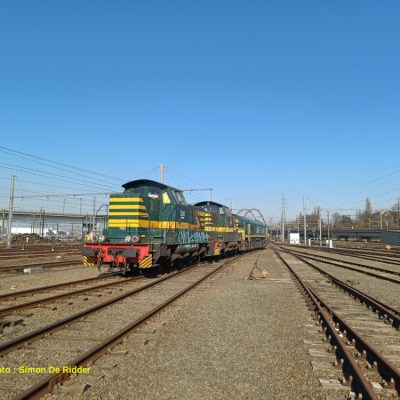 a train traveling down train tracks