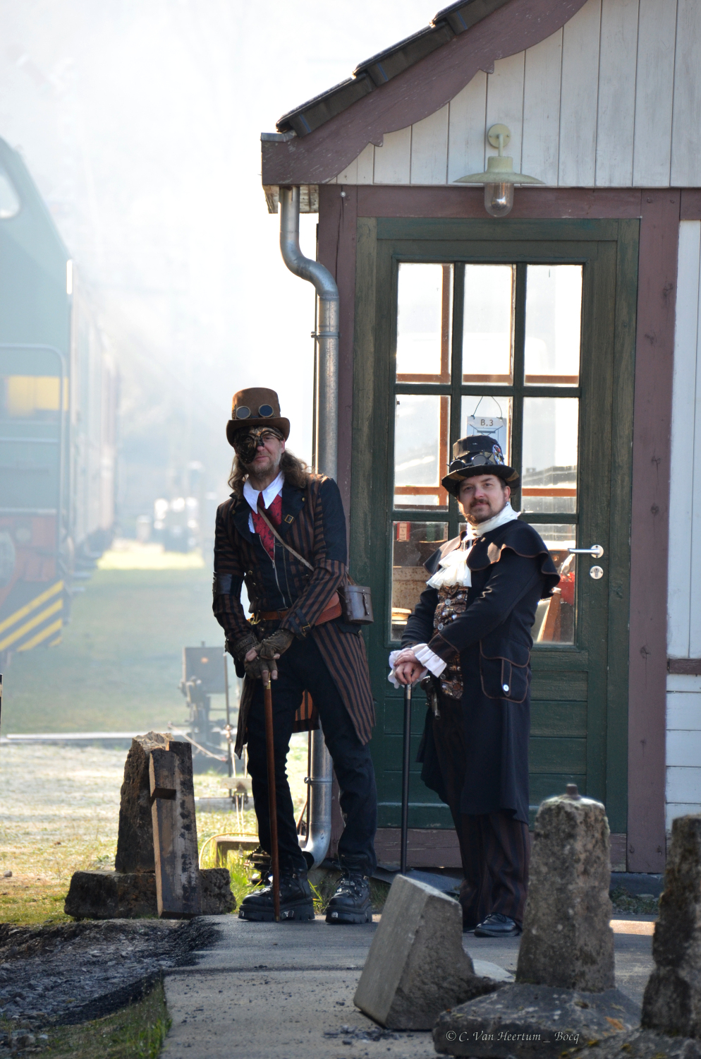 a man and a woman standing in front of a building