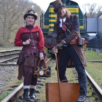 a group of people standing around a bench