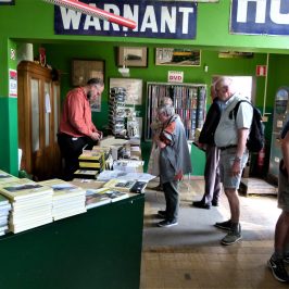 a group of people standing in front of a store