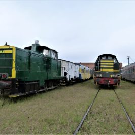 a train on a track near a field