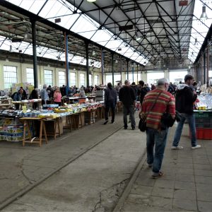 a group of people standing in a train station