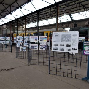 a group of people sitting at a train station