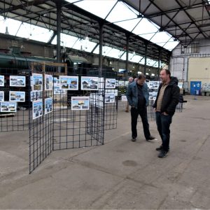 a group of people standing in a train station