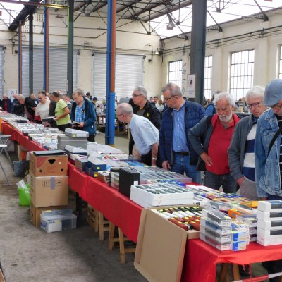 a group of people standing around a table