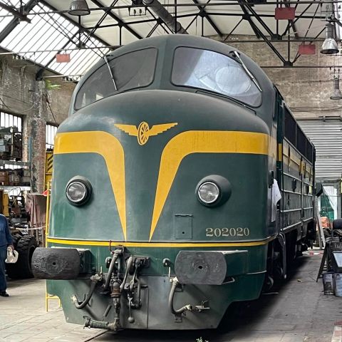 a person sitting at a train station