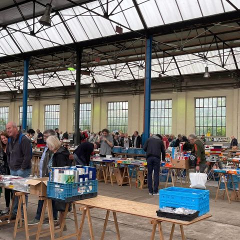 a group of people standing around a table
