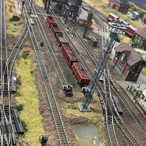a group of people traveling on a train track