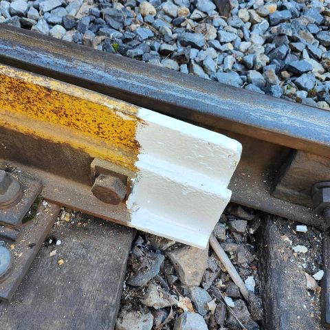 a piece of luggage sitting on top of a rock